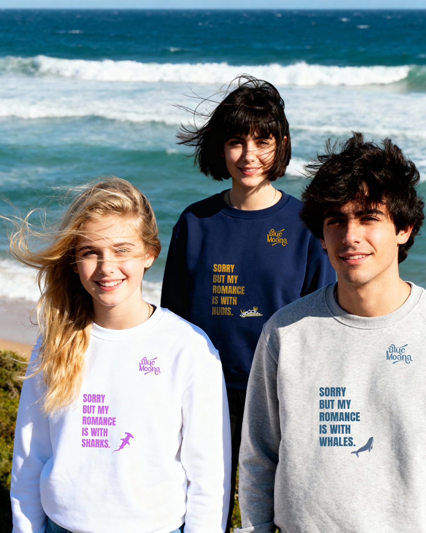 Three friends in seasonal sweatshirt drop on the coast