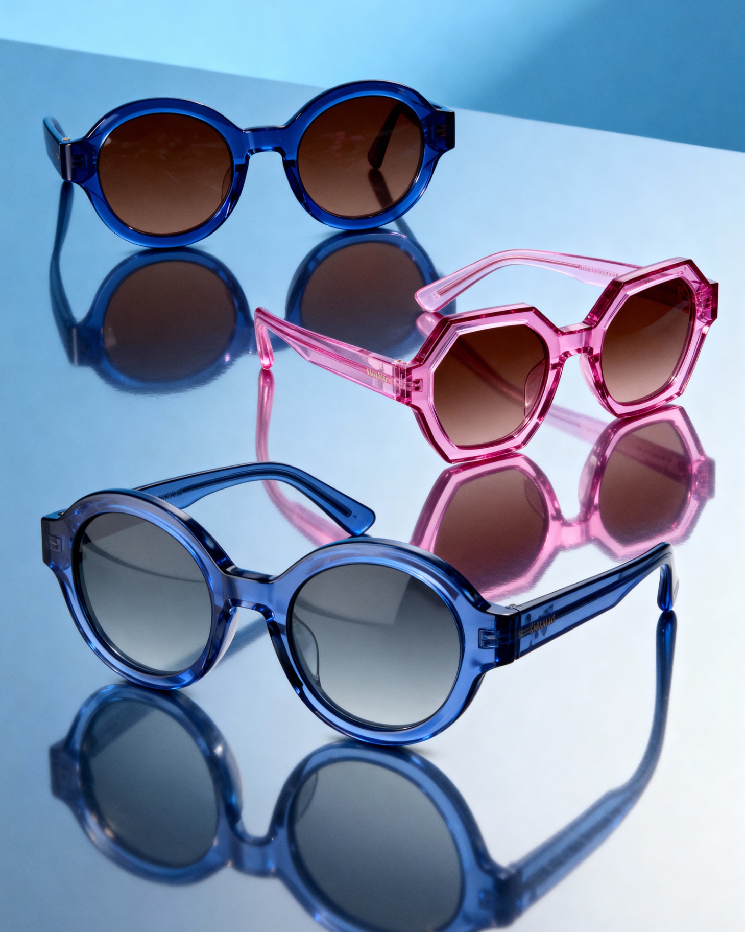 Studio still life — blue and pink acetate sunglasses